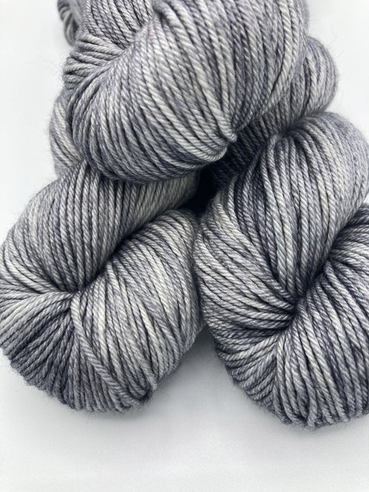 Three twisted hanks of Down Pour silk blend yarn by Red Door Fibers (tonal)