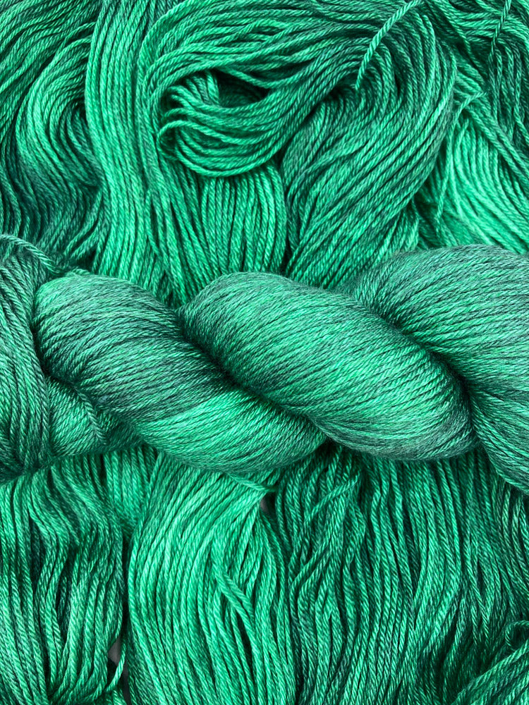 Twisted hanks of Emerald City silk blend yarn by Red Door Fibers (tonal)