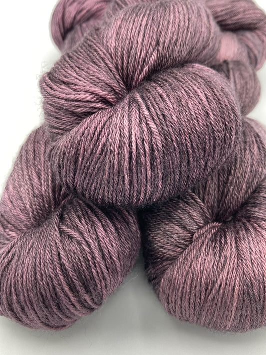 Three twisted hanks of Plum Dandy silk blend yarn by Red Door Fibers (tonal)