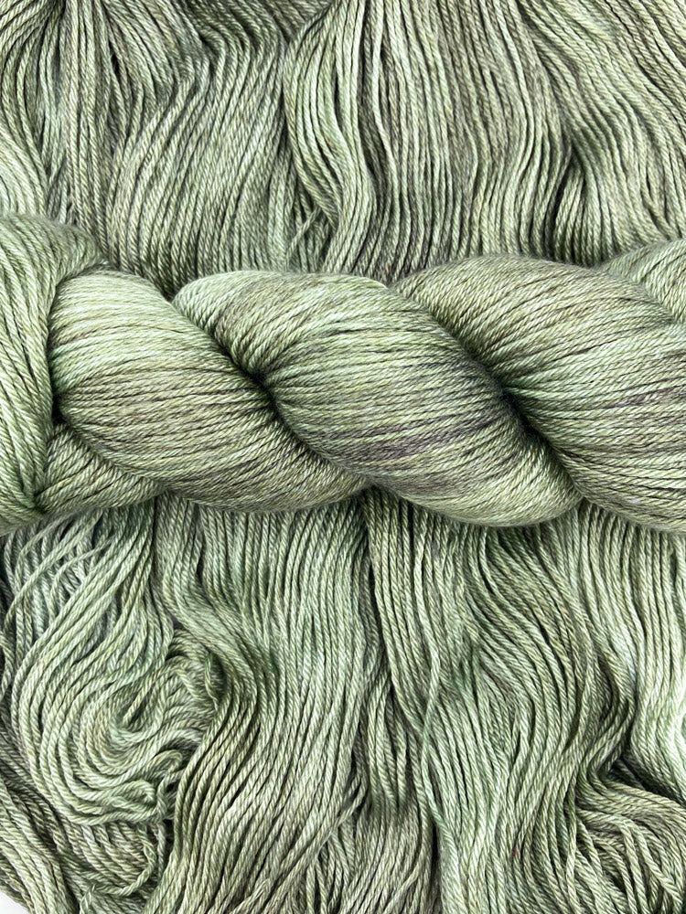 Twisted hank of Avocado silk blend yarn by Red Door Fibers (tonal)