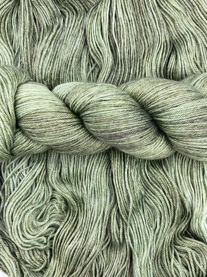 Twisted hank of Avocado silk blend yarn by Red Door Fibers (tonal)
