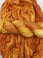 Twisted hank of Blazing Sun silk blend yarn by Red Door Fibers (yellow orange lighty variegated)