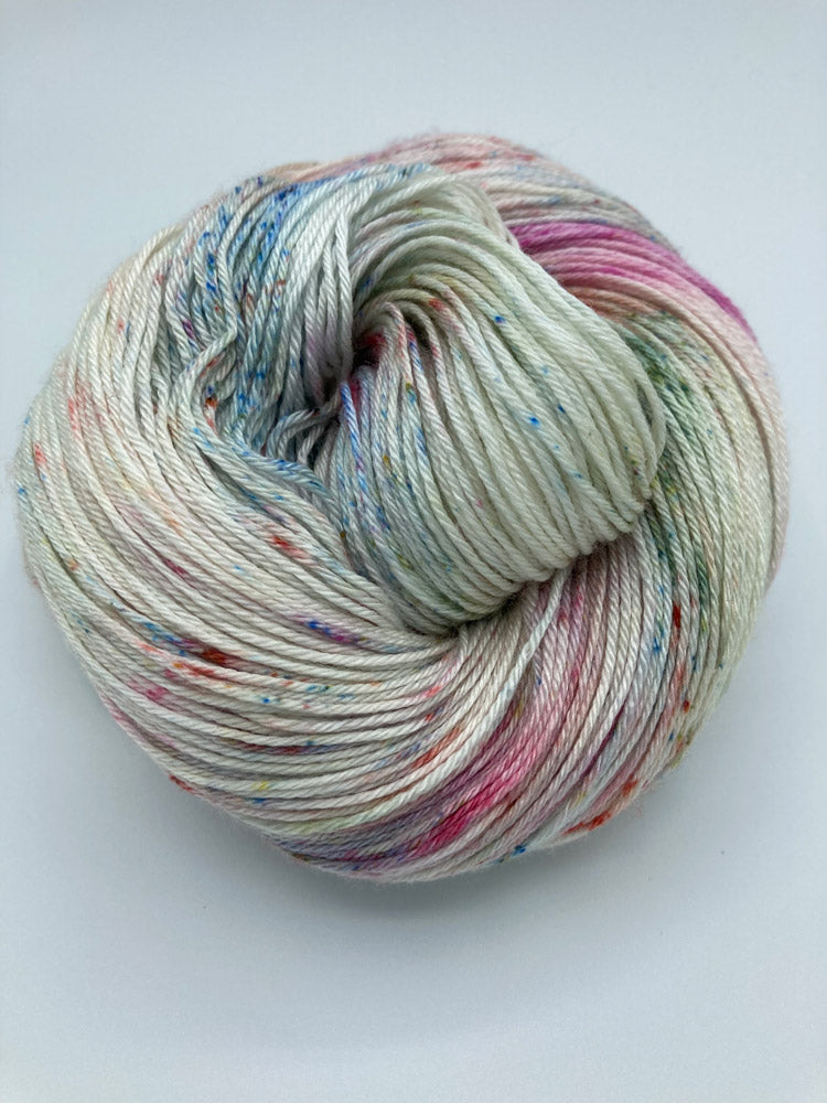 Rolled hank of Bouquet silk blend yarn by Red Door Fibers (variegated))