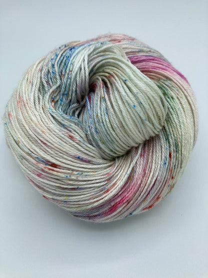 Rolled hank of Bouquet silk blend yarn by Red Door Fibers (variegated))