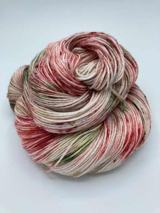 Rolled hank of Country Christmas silk blend yarn by Red Door Fibers (tonal)