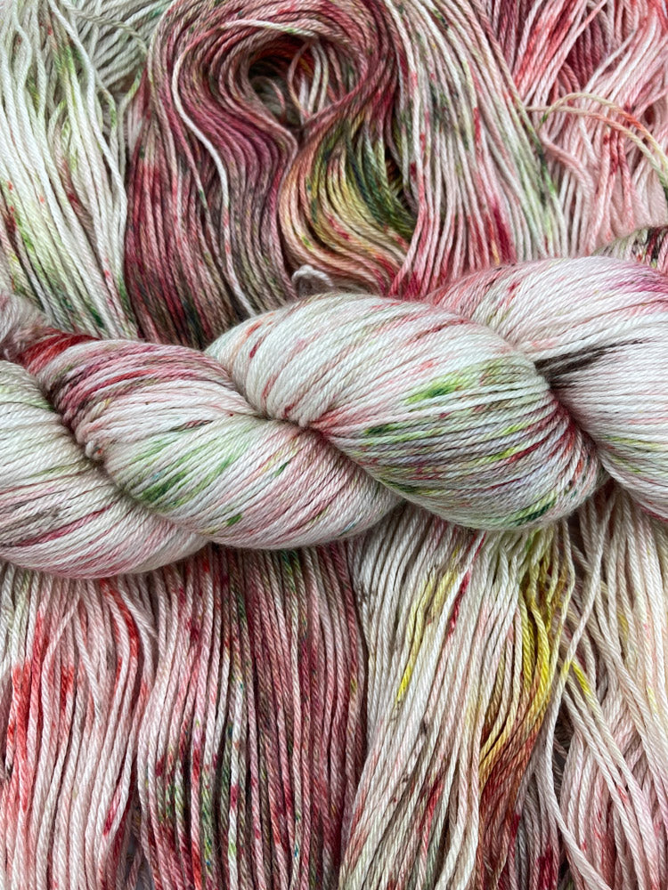 Twisted hanks of Cornsilk silk blend yarn by Red Door Fibers (tonal)