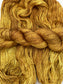 Twisted hanks of Cowardly Lion silk blend yarn by Red Door Fibers (tonal)