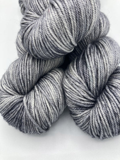 Three twisted hanks of Down Pour silk blend yarn by Red Door Fibers (tonal)