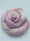 Rolled hank of Glinda the Good Witch silk blend yarn by Red Door Fibers (variegated)