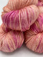 Three twisted hanks of Joyful Noise silk blend yarn by Red Door Fibers (lightly variegated)