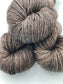 Three twisted hanks of Kodiak silk blend yarn by Red Door Fibers (solid)