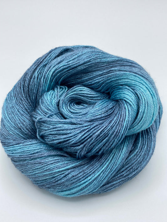 Rolled hanks of Lakeshore silk blend yarn by Red Door Fibers (tonal)