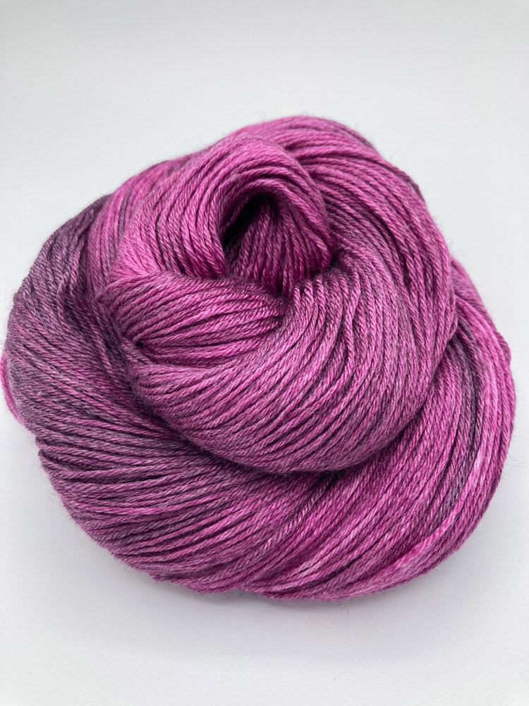 Rolled hank of Mulberry silk blend yarn by Red Door Fibers (tonal)