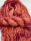 Twisted hank of Nuclear Fusion silk blend yarn by Red Door Fibers (lightly variegated)